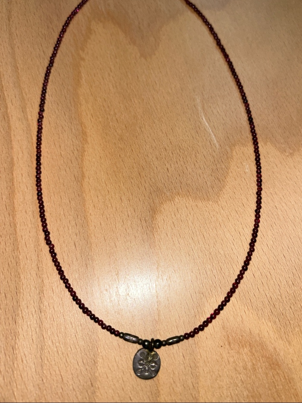 Hand Crafted Deep Garnet Bead Necklace with Antiqued Silver Charm
